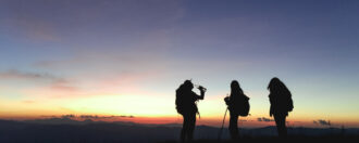 Three people on a hiking journey